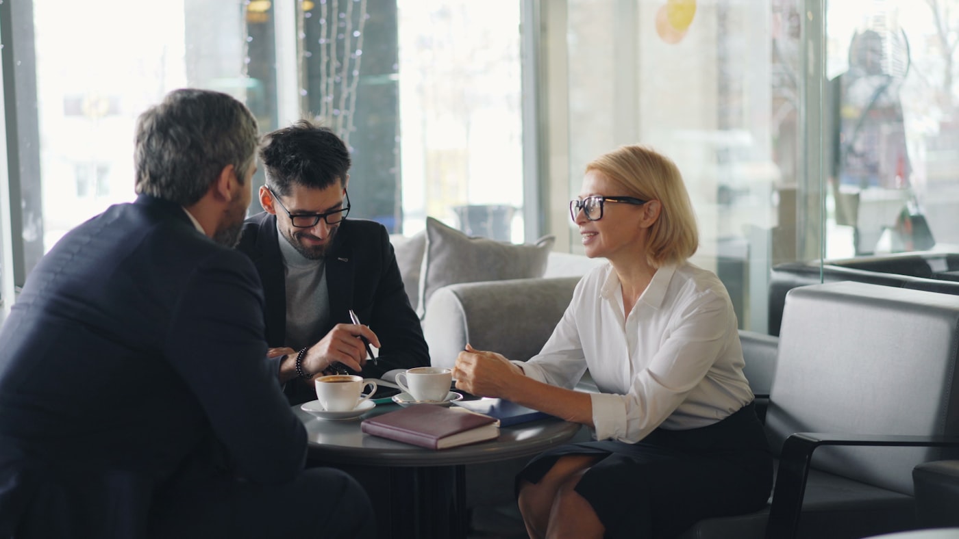 Financial advisor meeting with clients.