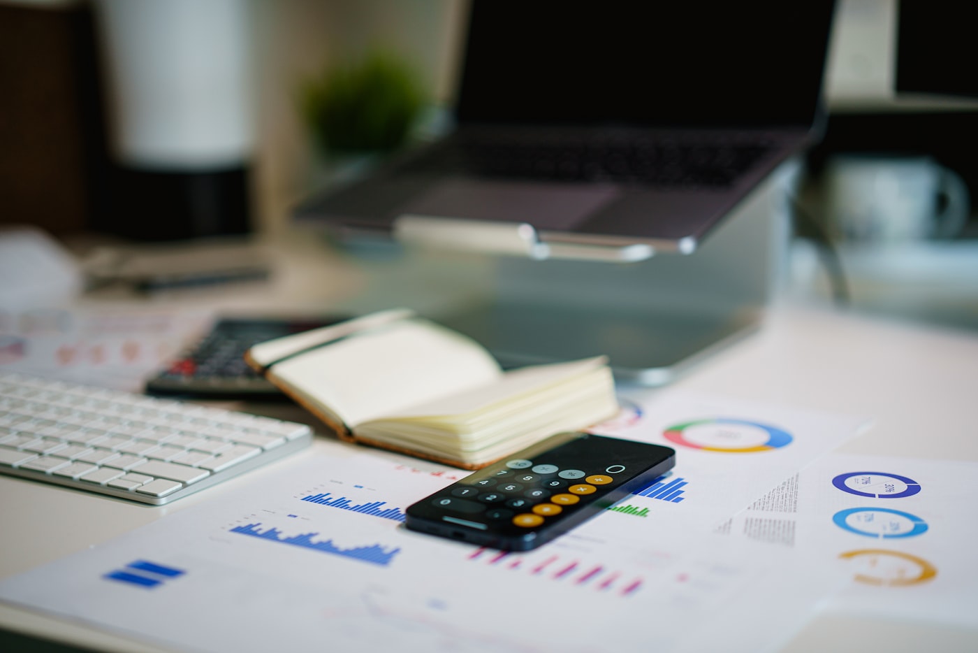 Financial services professional reviewing reports at a desk.