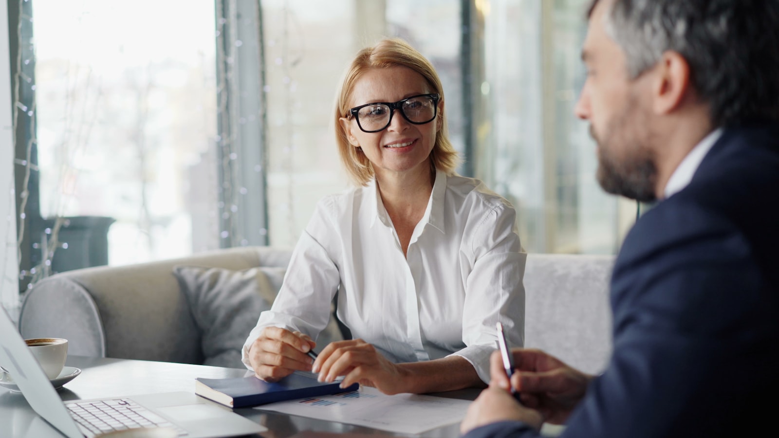 Real estate agent discussing options with clients.