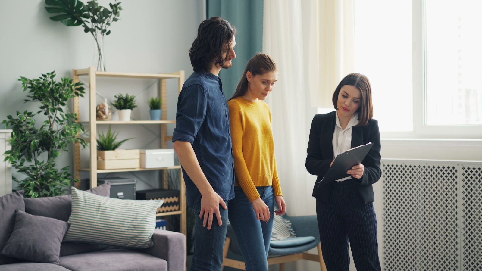 Real estate professional meeting with clients.